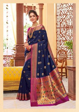 Shine Bright Wearing This Attractive Looking Saree In Navy Blue Color Paired With Contrasting Magenta Pink Colored Blouse. This Saree And Blouse Are Fabricated On Banarasi Art Silk Beautified With Weave. Buy This Saree Now.