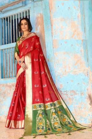 Flaunt Your Rich And Elegant Taste Wearing This Lovely Silk Based Saree In Red Color Paired With Contrasting Green Colored Blouse. This Saree And Blouse Are Fabricated On Cotton Silk Beautified With Weave. Buy Now.
