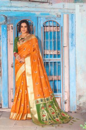 Shine Bright Wearing This Attractive Looking Saree In Musturd Yellow Color Paired With Contrasting Green Colored Blouse. This Saree And Blouse Are Fabricated On Cotton Silk Beautified With Weave. Buy This Saree Now.