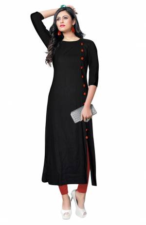 For Your Casual Wear, Grab This Simple And Elegant Looking Readymade Kurti In Black Color Fabricated On Rayon. It Is Beautified With Contrasting Buttons With A Front Side Slit. Its Fabric Is Soft Towards Skin And Available In All Regular Sizes. Buy This Pretty Kurti Now.