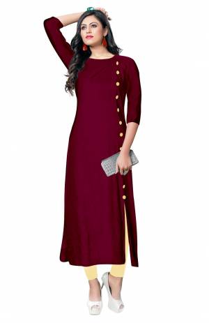 For Your Casual Wear, Grab This Simple And Elegant Looking Readymade Kurti In Magenta Pink Color Fabricated On Rayon. It Is Beautified With Contrasting Buttons With A Front Side Slit. Its Fabric Is Soft Towards Skin And Available In All Regular Sizes. Buy This Pretty Kurti Now.