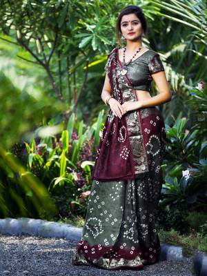 Here Is A Beautiful Bandhej Designer Saree In Grey And Wine Color. This Saree And Blouse Are Fabricated On Art Silk Which Also Gives A Rich Look To Your Personality. Buy Now.
