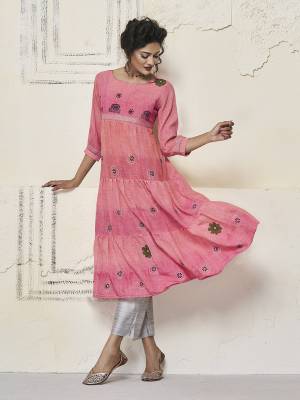 Get Ready For The Upcoming Festive Season With This Designer Readymade Kurti In Pink Color. This A-Line Patterned Kurti Is Fabricated on Cotton Slub Beautified With Contrasting Thread Work. 