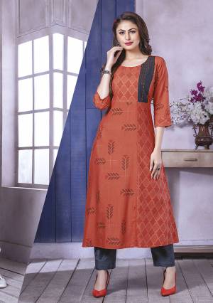Add This Pretty Kurti To Your Wardrobe In Rust Orange Color Fabricated On Rayon. This Readymade Straight Kurti Is Available In All Regular Sizes. 