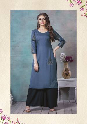 For Your Semi-Casuals, Grab This Readymade Kurti In Dark Blue Color. This Kurti Is Fabricated On Rayon Cotton Beautified With Prints And Thread Work. It Is Light In Weight And Easy To Carry All Day Long. 