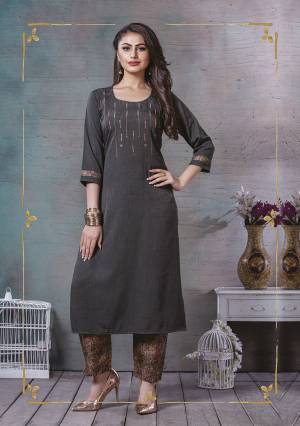 Add This Pretty Readymade Kurti To Your Wardrobe In Dark Grey Color Fabricated On Cotton Slub. It Is Beautified With Prints And Thread Work. Also It Is Available In All Regular Sizes. Buy Now.