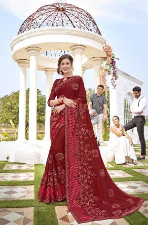 For A Royal Look, Grab This Heavy Designer Saree In Maroon Color Paired With Maroon Colored Blouse. This Saree Is Fabricated On Georgette And Brasso Paired With Art Silk Fabricated Blouse. It Is Beautified With Pretty Thread And Stone Work. Buy Now.