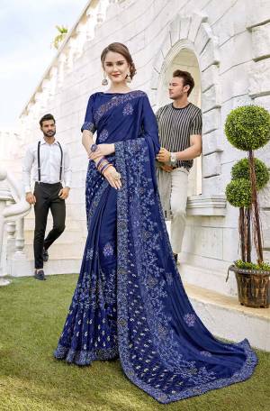 Shine Bright In This Designer Royal Blue Colored Saree Paired With Royal Blue Colored Blouse. This Saree Is Fabricated On Satin Georgette And Brasso Paired With Art Silk Fabricated Blouse. It Is Beautified With Embroidery And Highlighted With Brasso Fabric.