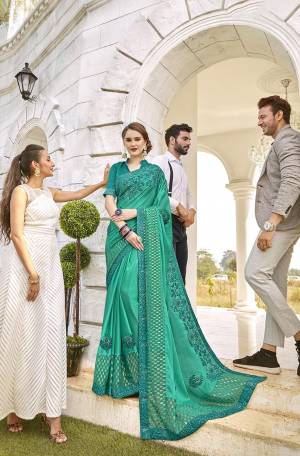 Grab This Beautiful Saree For The Upcoming Festive And Wedding Season In Sea Green Color. This Saree Is Fabricated On Satin And Brasso Paired With Art Silk Fabricated Blouse. Buy Now.