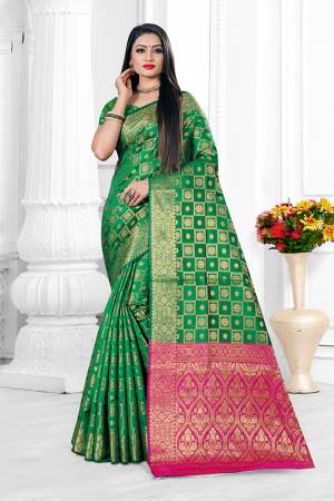 Here Is A Beautiful Designer Silk Based Saree In Green Color. This Pretty Checks Patterned Saree Is Fabricated On Banarasi Art Silk Paired With Art Silk Fabricated Blouse. Buy This Saree Now.