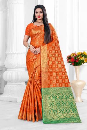 Here Is A Beautiful Designer Silk Based Saree In Orange Color. This Pretty Checks Patterned Saree Is Fabricated On Banarasi Art Silk Paired With Art Silk Fabricated Blouse. Buy This Saree Now.