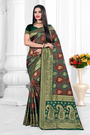 Adorn A Bold And Beautiful Look Wearing This Elegant Patterned Designer Saree In Teal Green And Maroon Color. This Saree Is Fabricated On Cotton Silk Paired With Art Silk Fabricated Blouse. Buy Now.