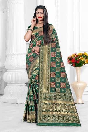 For A Proper Traditional Look With Traditional Color Pallete, Grab This Designer Saree In Teal Green Color. This Saree Is Fabricated On Banarasi Art Silk Beautified With Checks Pattern Paired With art Silk Fabricated Blouse.?