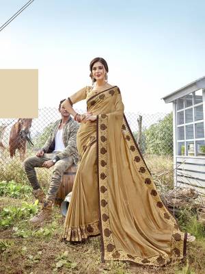 Celebrate This Festive Season Wearing This Designer Saree In Beige Color Paired With Beige Colored Blouse. This Saree Is Fabricated On Satin Georgette Paired With Art Silk Fabricated Blouse. 