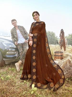 Shine Bright Wearing This Designer  Saree In Lovely Brown Color. This Saree Is Satin Georgette Based Paired With Art Silk Fabricated Blouse. Buy This Designer Piece Now.