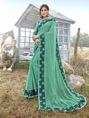 Catch All The Limelight Wearing This Pretty Saree In Sea Green Color Paired With Teal Blue And Sea Green Colored Blouse. This Saree Is Fabricated On Satin georgette Paired With Art Silk Fabricated Blouse. Buy Now.