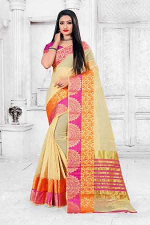 Adorn A Proper Traditional Look This Festive Season Wearing This Pretty Saree In Cream Color Paired With Dark Pink Colored Blouse. This Saree Is Fabricated on Cotton Silk Paired With Art Silk Fabricated Blouse. Buy This Lovely Saree Now. 