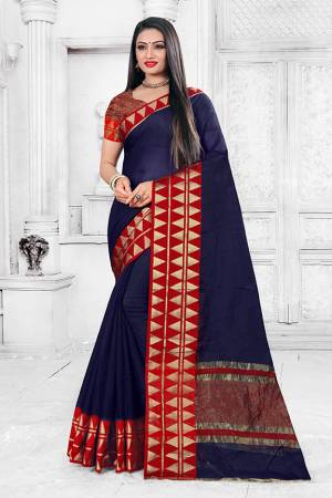 Enhance Your Personality Wearing This Silk Based Saree In Navy Blue Color Paired With Maroon Colored Blouse. This Pretty Weaved Saree Is Fabricated On Cotton Silk Paired With Art Silk Fabricated Blouse. Buy Now.