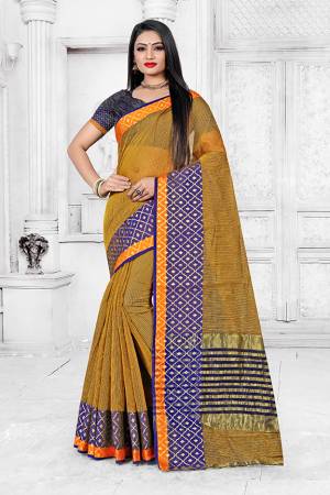 Enhance Your Personality Wearing This Silk Based Saree In Musturd Yellow Color Paired With Navy Blue Colored Blouse. This Pretty Weaved Saree Is Fabricated On Cotton Silk Paired With Art Silk Fabricated Blouse. Buy Now.