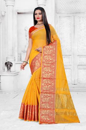 Adorn A Proper Traditional Look This Festive Season Wearing This Pretty Saree In Yellow Color Paired With Dark Orange Colored Blouse. This Saree Is Fabricated on Cotton Silk Paired With Art Silk Fabricated Blouse. Buy This Lovely Saree Now. 