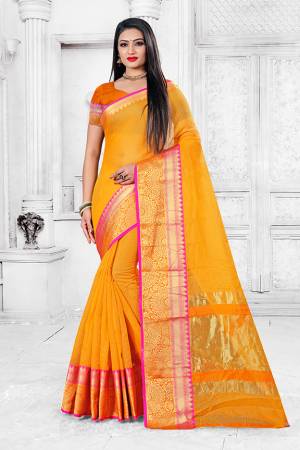 Enhance Your Personality Wearing This Silk Based Saree In Yellow Color Paired With Orange Colored Blouse. This Pretty Weaved Saree Is Fabricated On Cotton Silk Paired With Art Silk Fabricated Blouse. Buy Now.