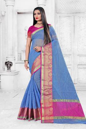 Adorn A Proper Traditional Look This Festive Season Wearing This Pretty Saree In Sky Blue Color Paired With Rani Pink Colored Blouse. This Saree Is Fabricated on Cotton Silk Paired With Art Silk Fabricated Blouse. Buy This Lovely Saree Now. 