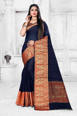 Adorn A Proper Traditional Look This Festive Season Wearing This Pretty Saree In Navy Blue Color Paired With Maroon Colored Blouse. This Saree Is Fabricated on Cotton Silk Paired With Art Silk Fabricated Blouse. Buy This Lovely Saree Now. 