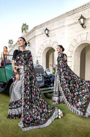 Bright And Visually Appealing Color Is Here With This designer Saree In Black And Grey Color Pairede With Black Colored Blouse. This Saree Is Fabricated On Lycra Paired With Art Silk Fabricated Blouse. It Is Beautified With Digital Prints And Stone Work. Buy Now.