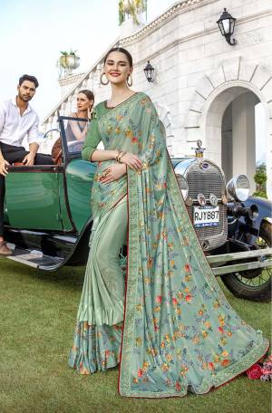 Get Ready For The Upcoming Festive And Wedding Season With This Very Beautiful Designer Saree In Pastel Green Color Paired With Green Colored Blouse. This Saree IS Lycra Based Beautified With Prints And Stone Work Paired With Art Silk Fabricated Blouse. Buy Now.
