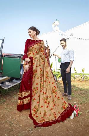 Bright And Visually Appealing Color Is Here With This designer Saree In Beige And Maroon Color Pairede With Maroon Colored Blouse. This Saree Is Fabricated On Lycra Paired With Art Silk Fabricated Blouse. It Is Beautified With Digital Prints And Stone Work. Buy Now.