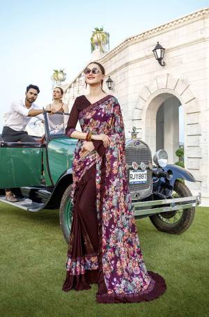 Get Ready For The Upcoming Festive And Wedding Season With This Very Beautiful Designer Saree In Purple And Wine Color Paired With Wine Colored Blouse. This Saree IS Lycra Based Beautified With Prints And Stone Work Paired With Art Silk Fabricated Blouse. Buy Now.