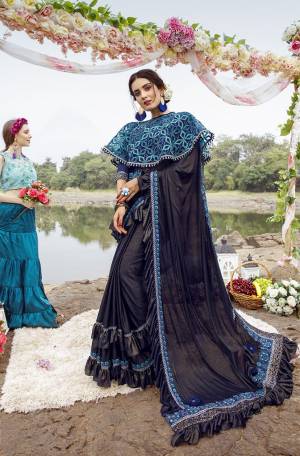 Grab This Very Beautiful Trendy Saree In Navy Blue Color. This Saree Is Fabricated On Lycra Paired With Art Silk Blouse And Net Fabricated Heavy Embroidered Cape. Its Fabric Is Light Weight And Ensures Superb Comfort Throughout The Gala.