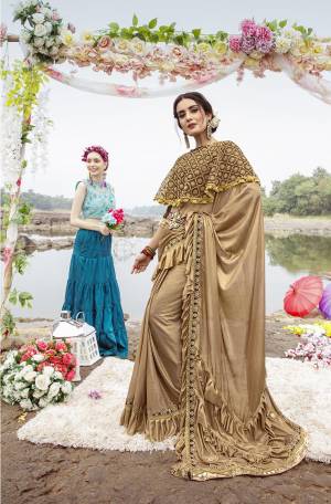 Grab This Very Beautiful Trendy Saree In Beige And Brown Color. This Saree Is Fabricated On Lycra Paired With Art Silk Blouse And Net Fabricated Heavy Embroidered Cape. Its Fabric Is Light Weight And Ensures Superb Comfort Throughout The Gala.