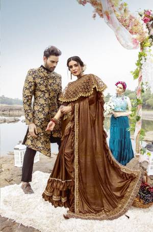 For A Royal Look, Grab This Designer Fancy Saree With Cape In Brown Color. This Pretty Saree Is Fabricated On Lycra Paired With Art Silk Fabricated Blouse And Embroidered Net Fabricated Cape. Its Trendy Pattern And Design Will Earn You Lots Of Compliments From Onlookers.