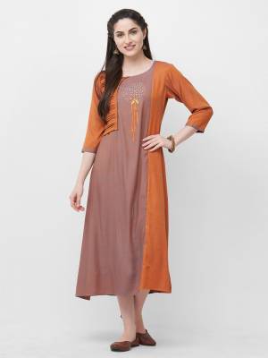 Simple Kurti IS Here For Your Casual Or Semi-Casual Wear In Rust Orange Color. This Kurti Is Rayon Based Which Is Durable And Easy To Care For.