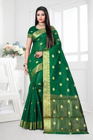 Enhance Your Personality Wearing This Silk Based Saree In Green Color. This Pretty Weaved Saree Is Fabricated On Cotton Silk Paired With Art Silk Fabricated Blouse. Buy Now.