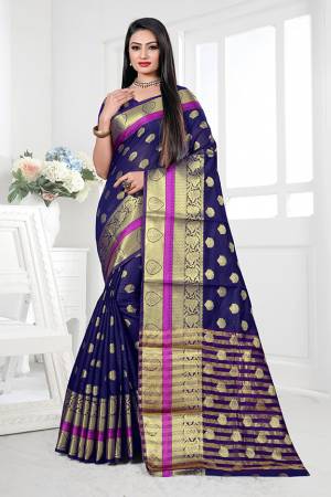 Adorn A Proper Traditional Look This Festive Season Wearing This Pretty Saree In Navy Blue Color. This Saree Is Fabricated on Cotton Silk Paired With Art Silk Fabricated Blouse. Buy This Lovely Saree Now.
