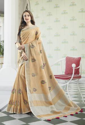 Flaunt Your Rich And Elegant Taste Wearing This Lovely Beige Colored Designer Saree. This Saree And Blouse Are Fabricated On Linen Cotton Which Gives A Rich Look To Your Personality. It Is Beautified With Embroidered Butti All Over The Saree. 