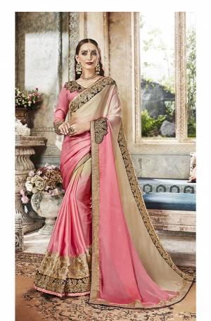 Here Is A Beautiful Designer Saree In Pink And Cream Color Paired With Pink Colored Blouse. This Saree Is Fabricated On Satin Paired With Art Silk Fabricated Blouse. Its Designer Pattern Will Give You Look Like Never Before. 