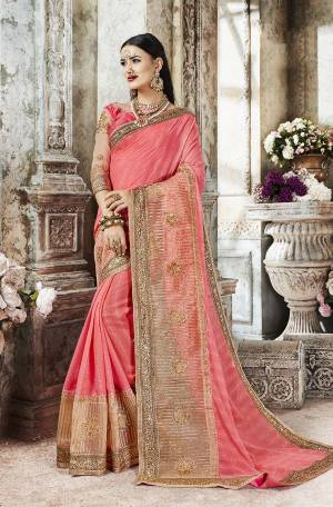 Enhance Your Personality Wearing This Heavy Designer Saree In Pink Color Paired With Pink Colored Blouse. This Saree Is Fabricated On Fancy Georgette And Orgenza Paired With Art Silk And Net Fabricated Embroidered Blouse. Buy This Designer Piece Now.