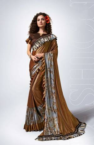 Enhance Your Personality Wearing This Very Beautiful Designer Saree?In Brown Color Paired With Brown Colored Blouse. This Saree Is Fabricated On Lycra Paired With Art Silk Fabricated Blouse. Its Rich Color Will Earn You Lots Of Compliments From Onlookers.