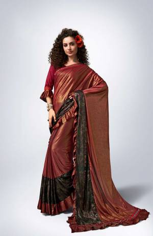 Here Is A Royal Looking Designer Saree In Maroon Color Paired With?Maroon Colored Blouse. This Saree Is Fabricated On Lycra Paired With Art Silk Fabricated Blouse. It Is Beautified With Frill And Lace Border. Buy This Designer Saree Now