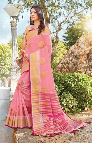 Look Pretty In This Elegant And Rich Looking Saree In Pink Color Paired With Pink Colored Blouse. This Saree And Blouse Are Fabricated On Linen Cotton Beautified With Weave. This Saree Is Light Weight, Durable And Easy To Carry All Day Long. 