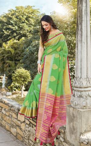 Look Pretty In This Elegant And Rich Looking Saree In Green Color Paired With Green Colored Blouse. This Saree And Blouse Are Fabricated On Linen Cotton Beautified With Weave. This Saree Is Light Weight, Durable And Easy To Carry All Day Long. 