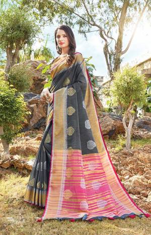 Look Pretty In This Elegant And Rich Looking Saree In Dark Grey Color Paired With Dark Grey Colored Blouse. This Saree And Blouse Are Fabricated On Linen Cotton Beautified With Weave. This Saree Is Light Weight, Durable And Easy To Carry All Day Long. 