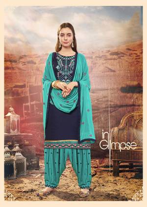 Get Ready For The Upcoming Festive Season With This Designer Patiala Suit In Navy Blue Colored Top Paired With Turquoise Blue Colored Bottom And Dupatta. Its Top Is Fabricated On Cotton Silk Paired With Rayon Bottom And Chiffon Fabricated Dupatta. It Is Beautified With Embroidery All over. 