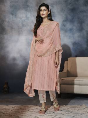 You Will Definitely Earn Lots Of Compliments Wearing This Elegant Looking Readymade Suit In Light Peach Colored Top And Dupatta Paired With Off-White Colored Bottom. Its TopIs Fabricated On Chanderi Cotton Paired With Rayon Pant And Chiffon Fabricated Dupatta. 