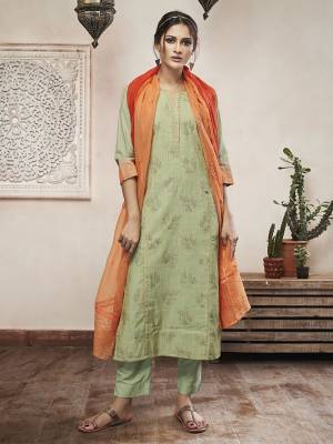This Festive Season, Adorn A Rich Traditional Look Wearing This Designer Readymade Suit In Pastel Green Color Paired With Contrasting Orange Colored Dupatta. Its Top Is Fabricated On Cotton Silk Paired With Cotton Satin Bottom And Super Net Fabricated Dupatta. 