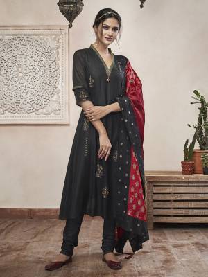 For A Bold And Beautiful Look, Grab This Designer Readymade A-Line Patterned Suit In Black Color Paired With Red Colored Dupatta. Its Top Is Fabricated On Chanderi Silk Paired With Poly Silk Chudidar And Silk Fabricated Dupatta. 