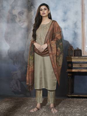 New And Unique Shade Is Here Add Into Your Wardrobe With This Designer Readmade Suit In Sand Grey Color Paired With Brown Colored Dupatta. Its Elegant Top And Pant Are Satin Based Paired With Chanderi Cotton Dupatta. 